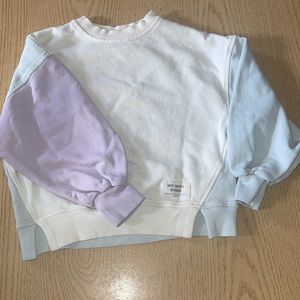 Very cute multi color sweater can go with light blue jeans